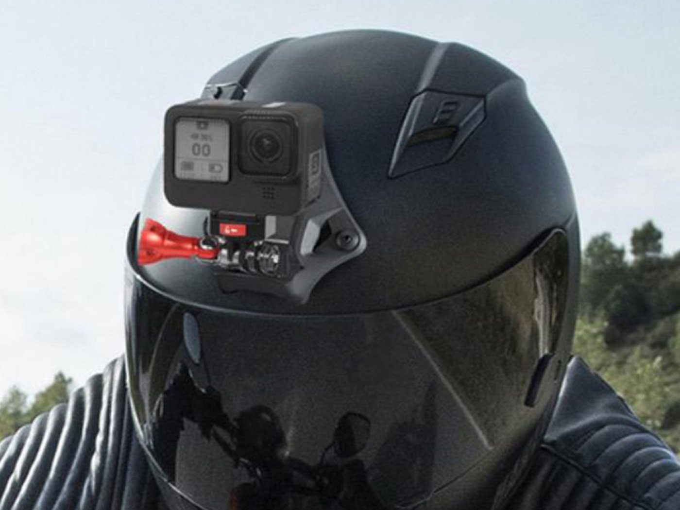 Červený zajišťovací šroub k adaptéru akční kamery